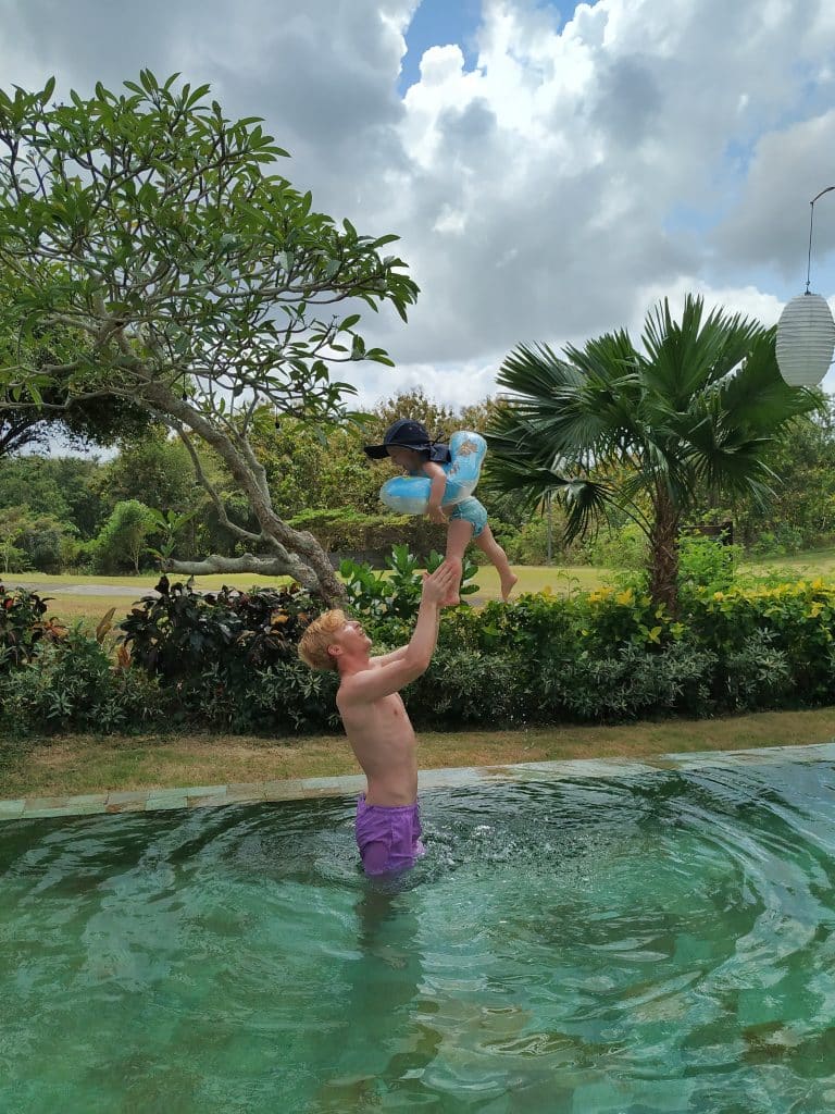 Father and son in Bali in pool