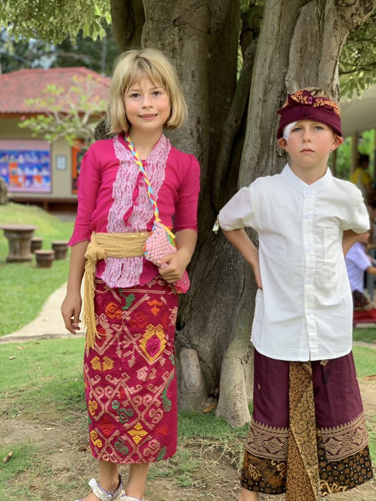 Amercian expat kids wearing Balinese costumes