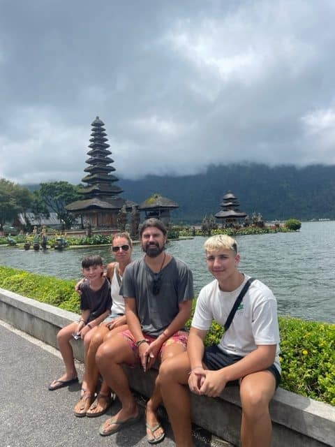 expat family visiting water temple in Bali