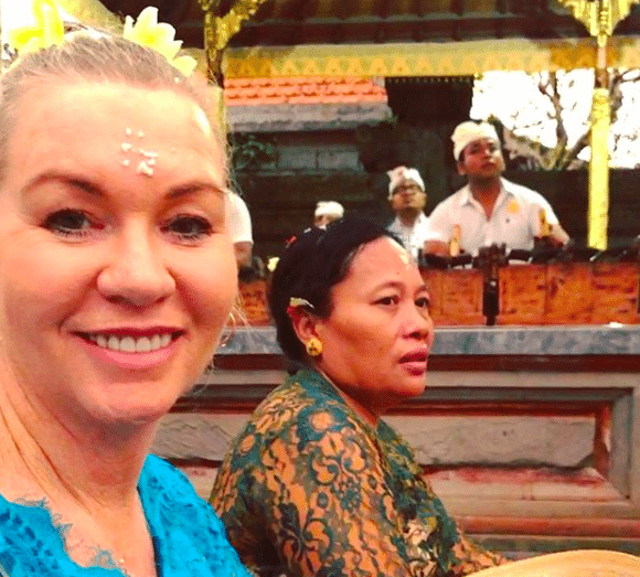 Jules Thomson, of Indah Escapes, wearing a kebaya attending a Balinese ceremony in a Hindu temple.