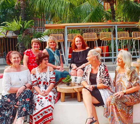 A group of women relaxing and smiling as part of Australian Expat Jules Thomson’s Indah Escapes Bali Tour Group