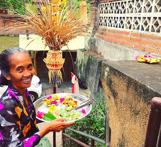 A local Balinese woman in Sanur carries Canang sari to do her morning blessing.