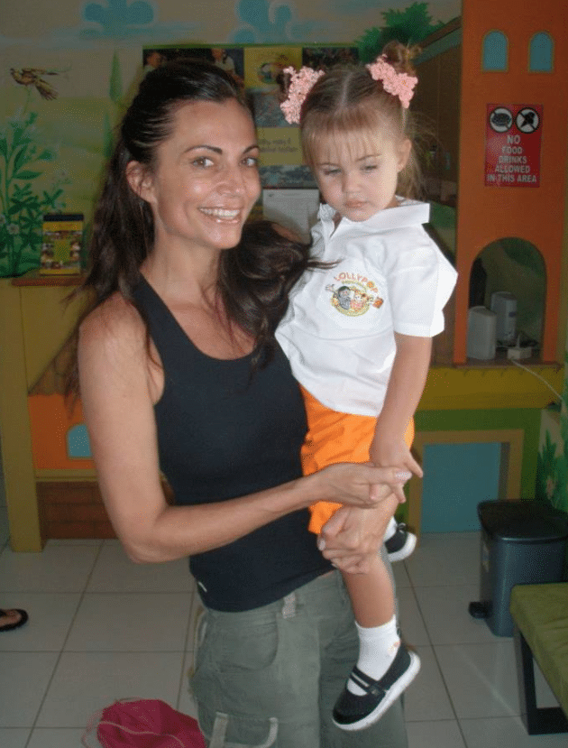 Lee Anna, with her young daughter, Shanti, who is wearing her Lollypop prep-school uniform.