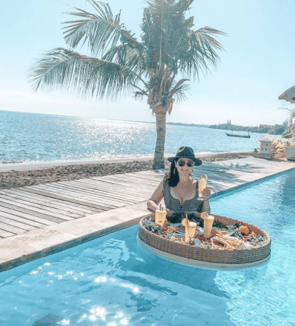 Karlie relaxing in a beach-side pool in Bali.