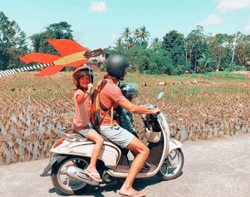 Kite flying and riding motorbike in Bali
