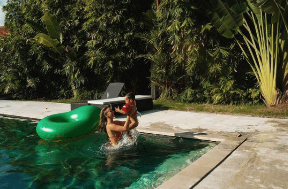 Cath and Seth in swimming pool in villa in Berawa