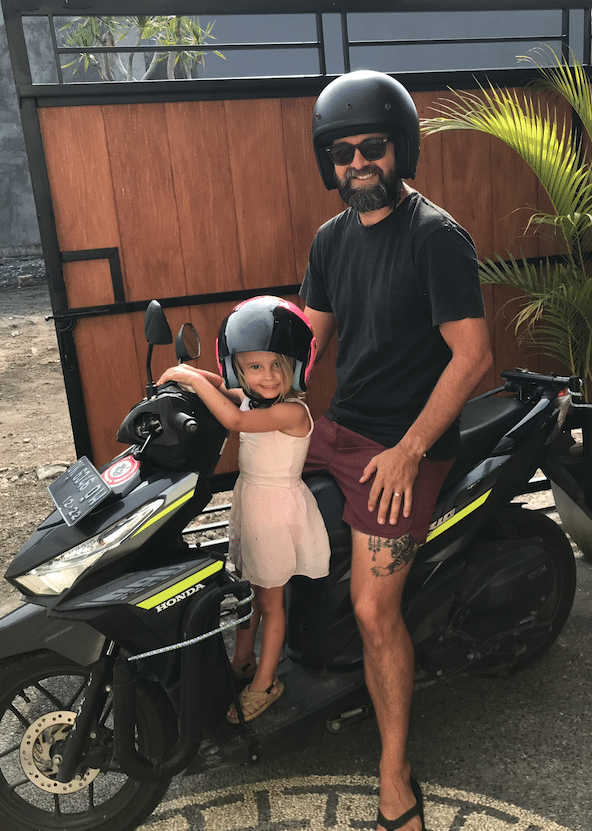 father and daughter on scooter in Bali