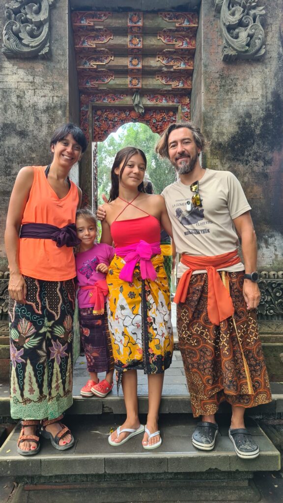 Spanish family in traditional costume outside Bali temple