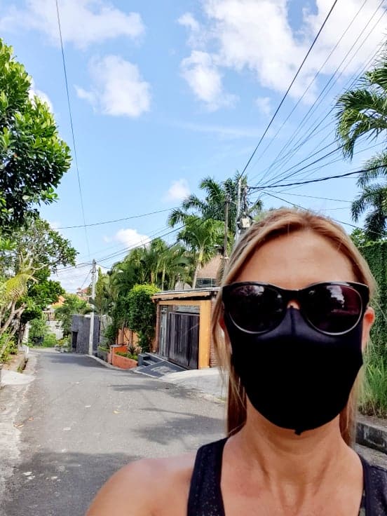 A selfie of Rachel Zubak in a Balinese street, wearing her facemask during the COVID-19 Pandemic.