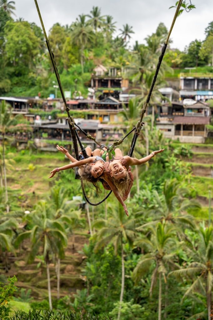 Young girls swinging on the Ubud Swing