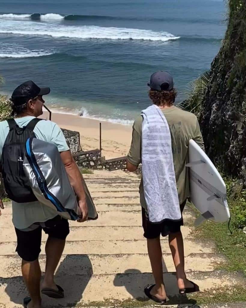 Father and son going for a surf in Uluwautu