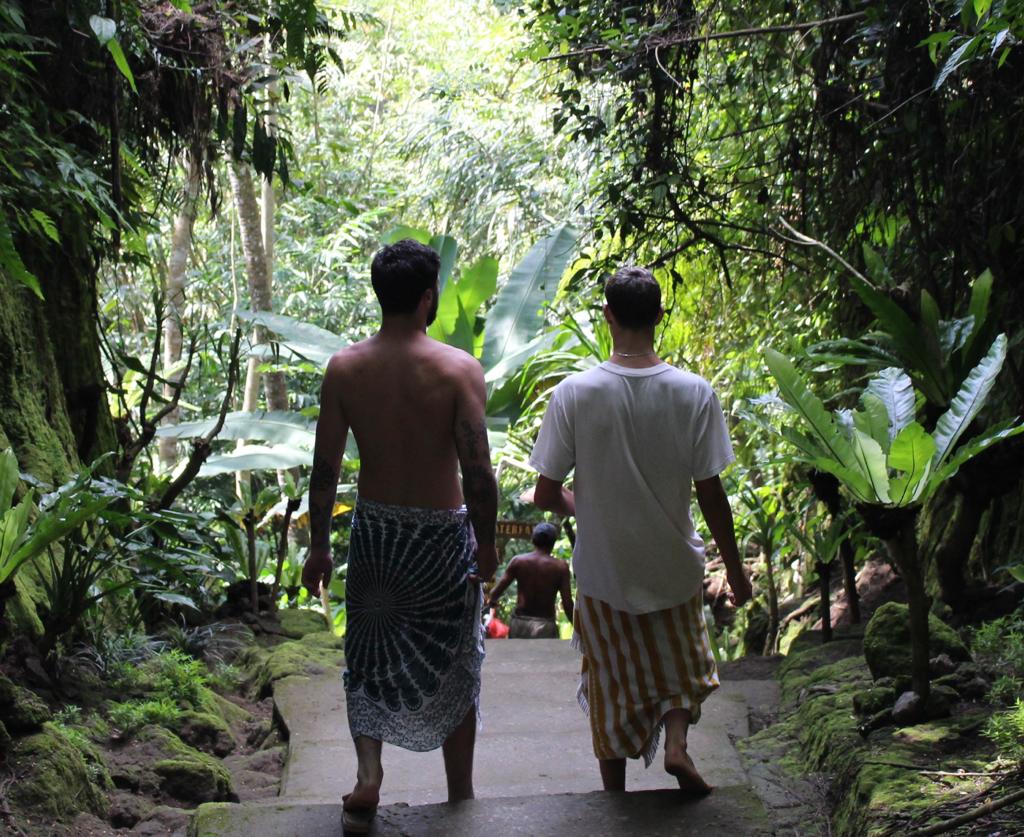 Father and son walking to beach in Bali